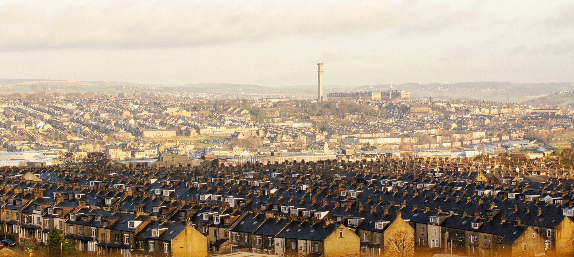 Ss winters mornings sunshine in a urban city landscape looking across terrace houses in bradford west yorkshire england